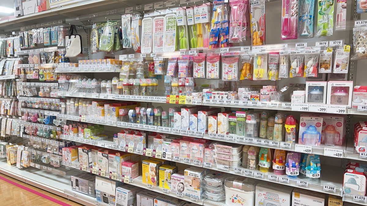 Nishimatsuya feeding aisle showing a wide range of baby bottles, teats, and weaning accessories